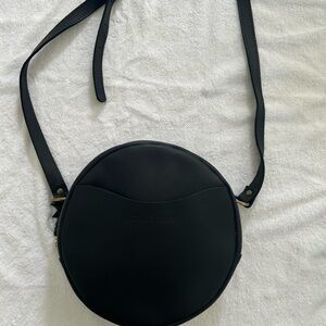 Black Round Crossbody Bag by Portland Lesther